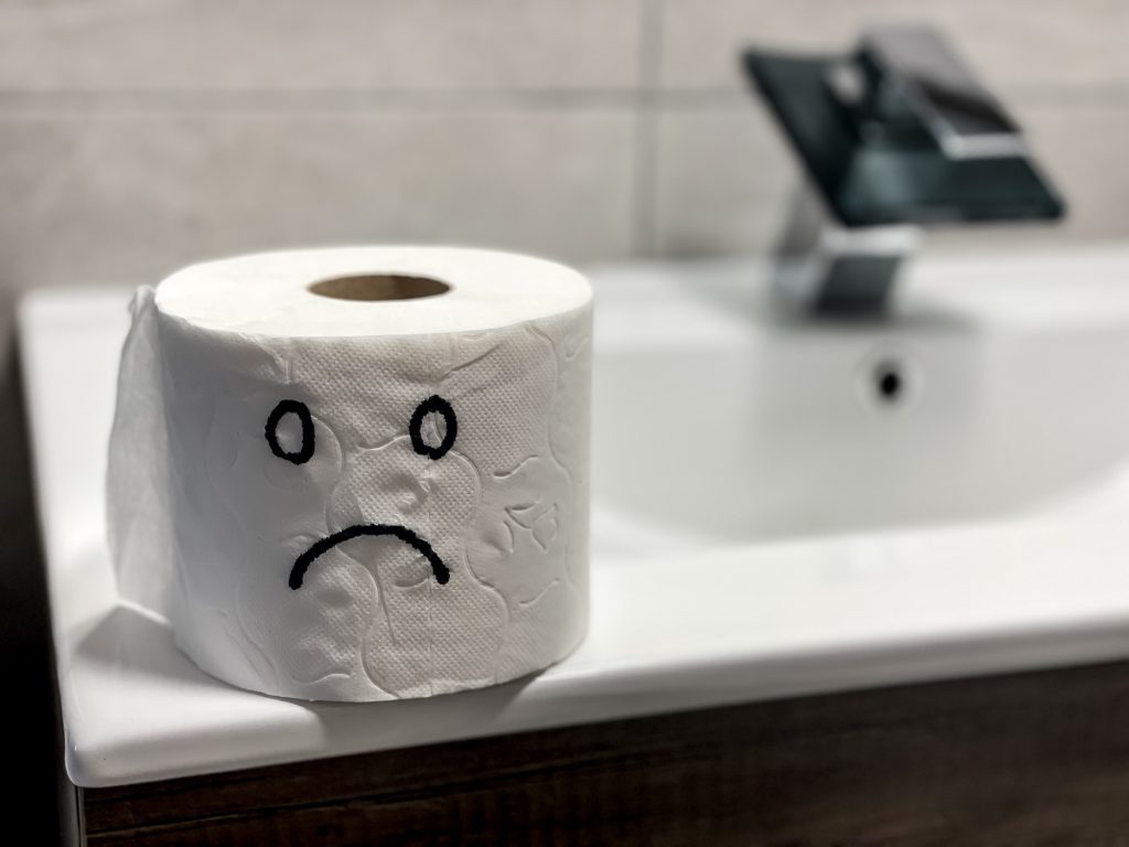 sad concept of toilet paper in bathroom
