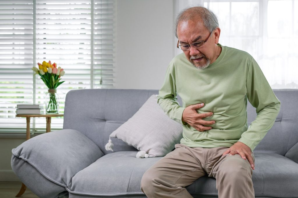 Senior man feeling suffer from terrible stomachache
